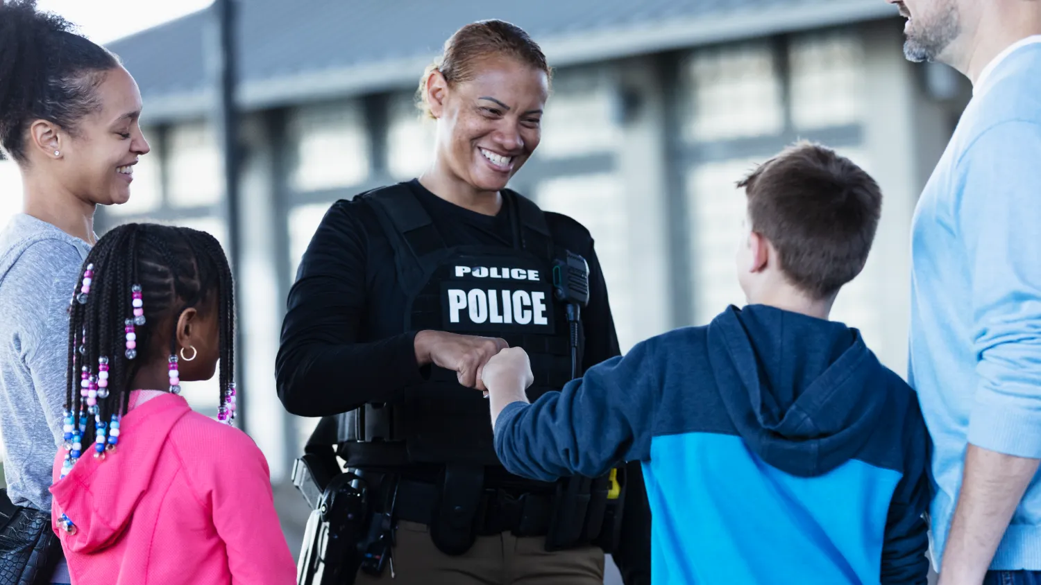 Female police officer with children